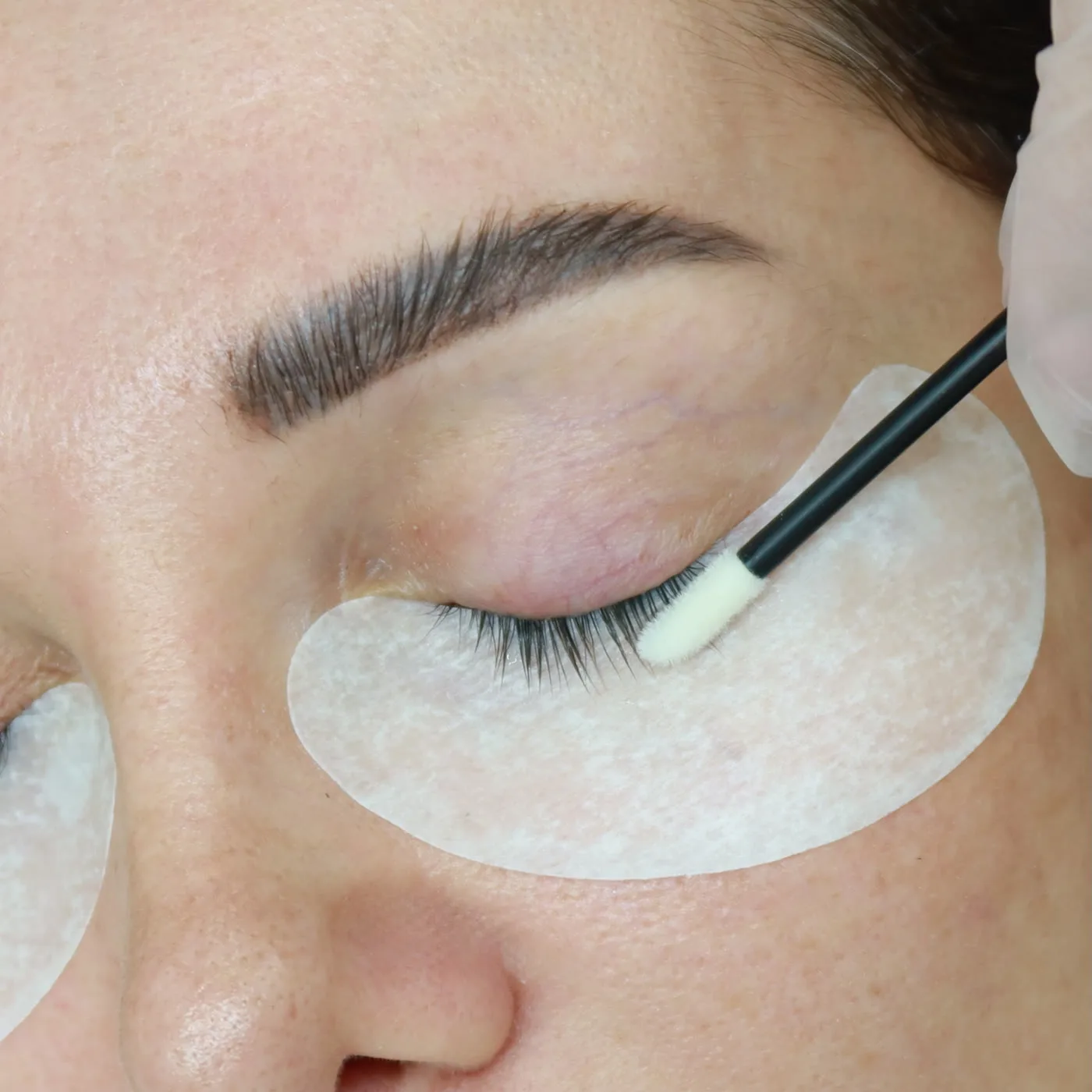 Classic lash extensions in Dubai — natural lashes primed and combed at AZIZAM beauty salon